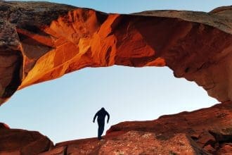 person-standing-on-a-rock-formation-3624336