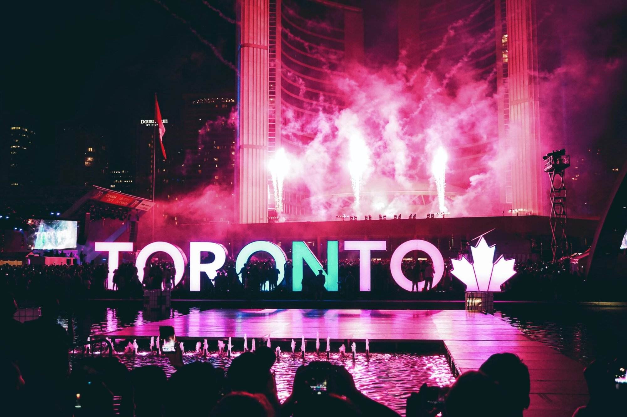An event happening in the city of Toronto, Canada. The word 'Toronto' is written in capitals below the stage. Six Municipalities make up the largest city in Canada, Toronto.
