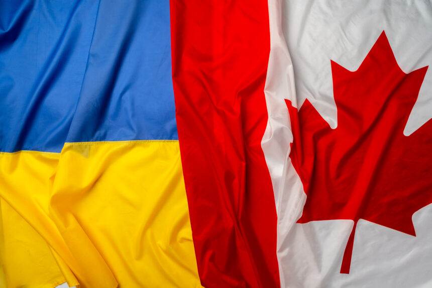 A picture of two flags of Ukraine and Canada merged together. Canada Pm announces new sanctions to aid Ukraine.