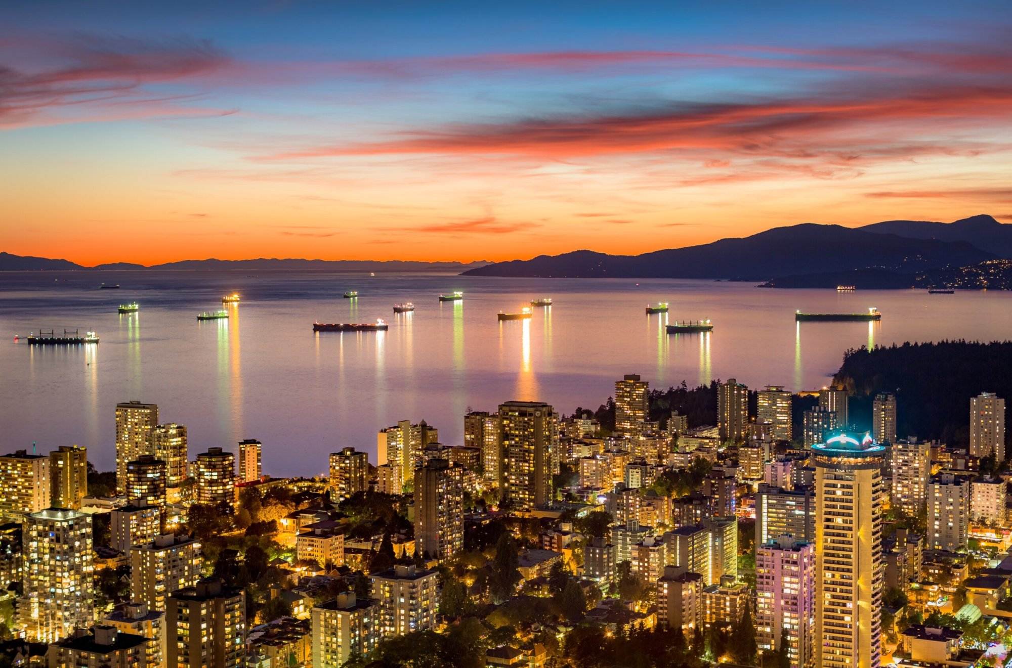 A sunset view of high-rise buildings in Vancouver City. The attractions in Vancouver are many to take a glimpse of.