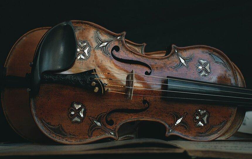 A close-up of a violin with a design made on it.