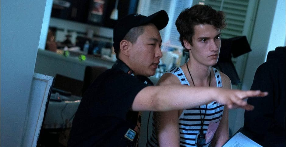 A guide telling a student about filming.