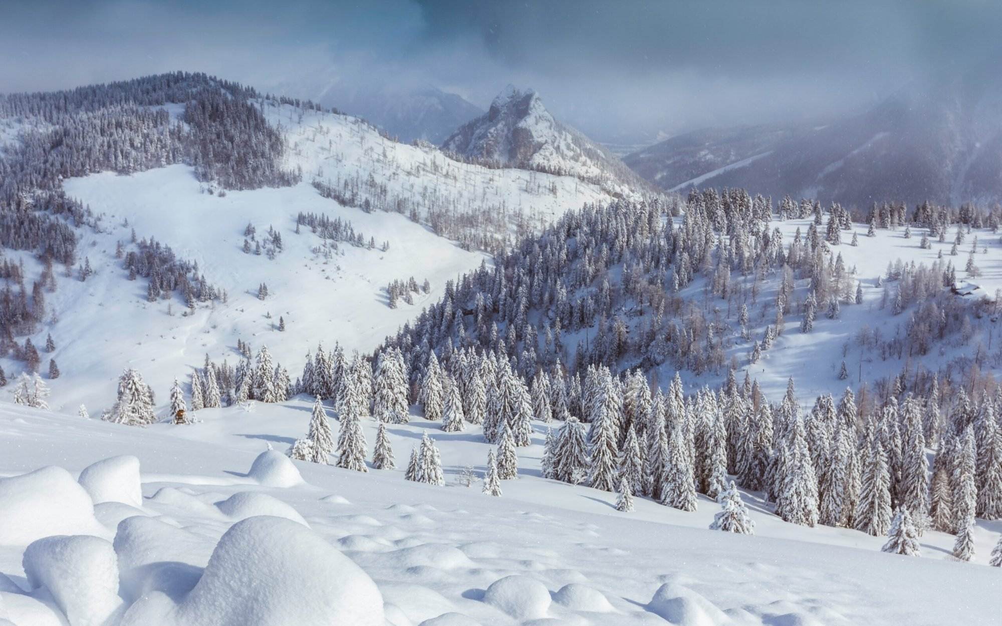 A view of snow-filled grounds and mountains in Canada.