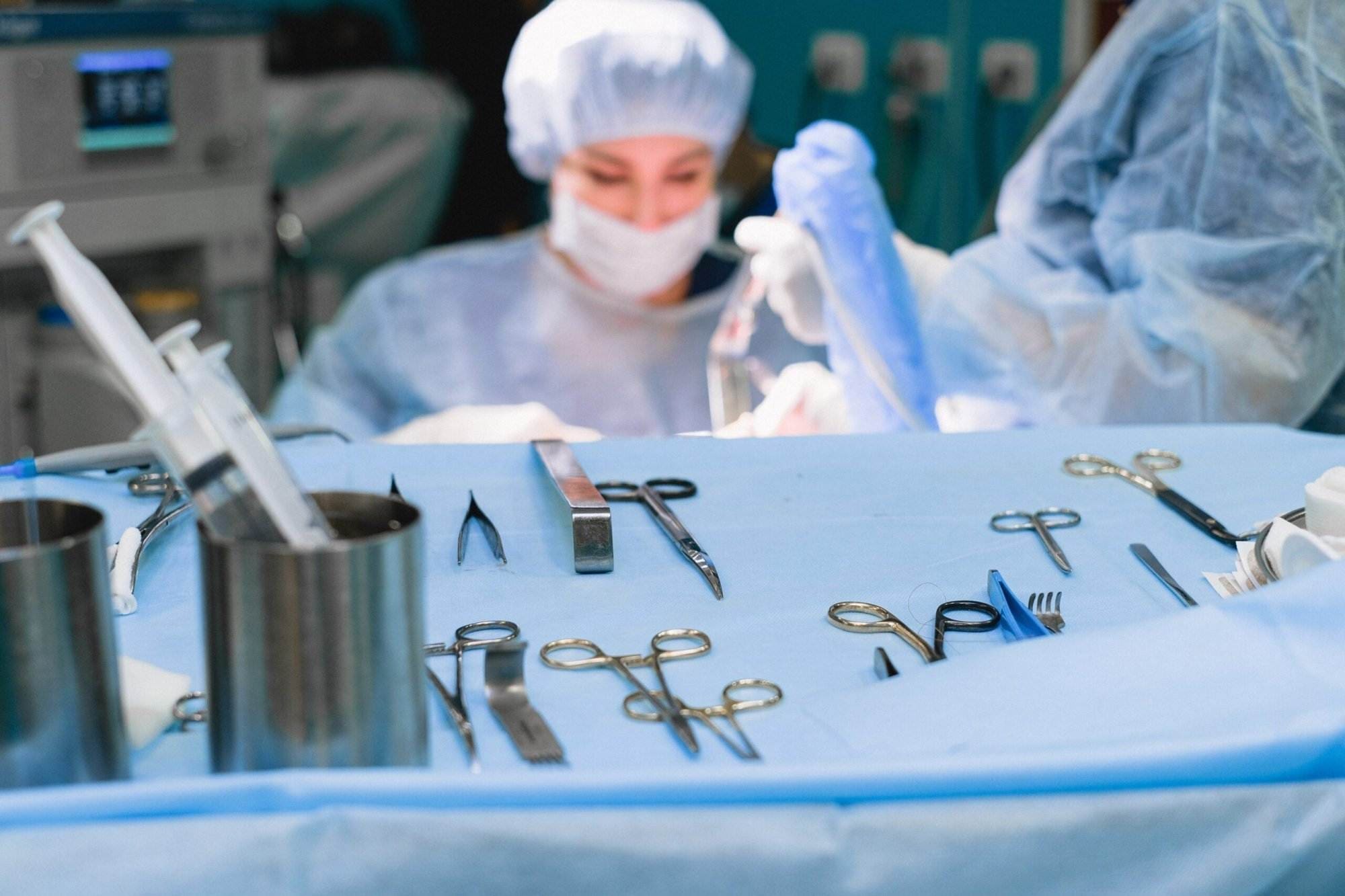 A view Surgeon performing surgery in an operation room.