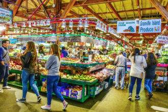 People buy vegetables in the farmers market in Vancouver.