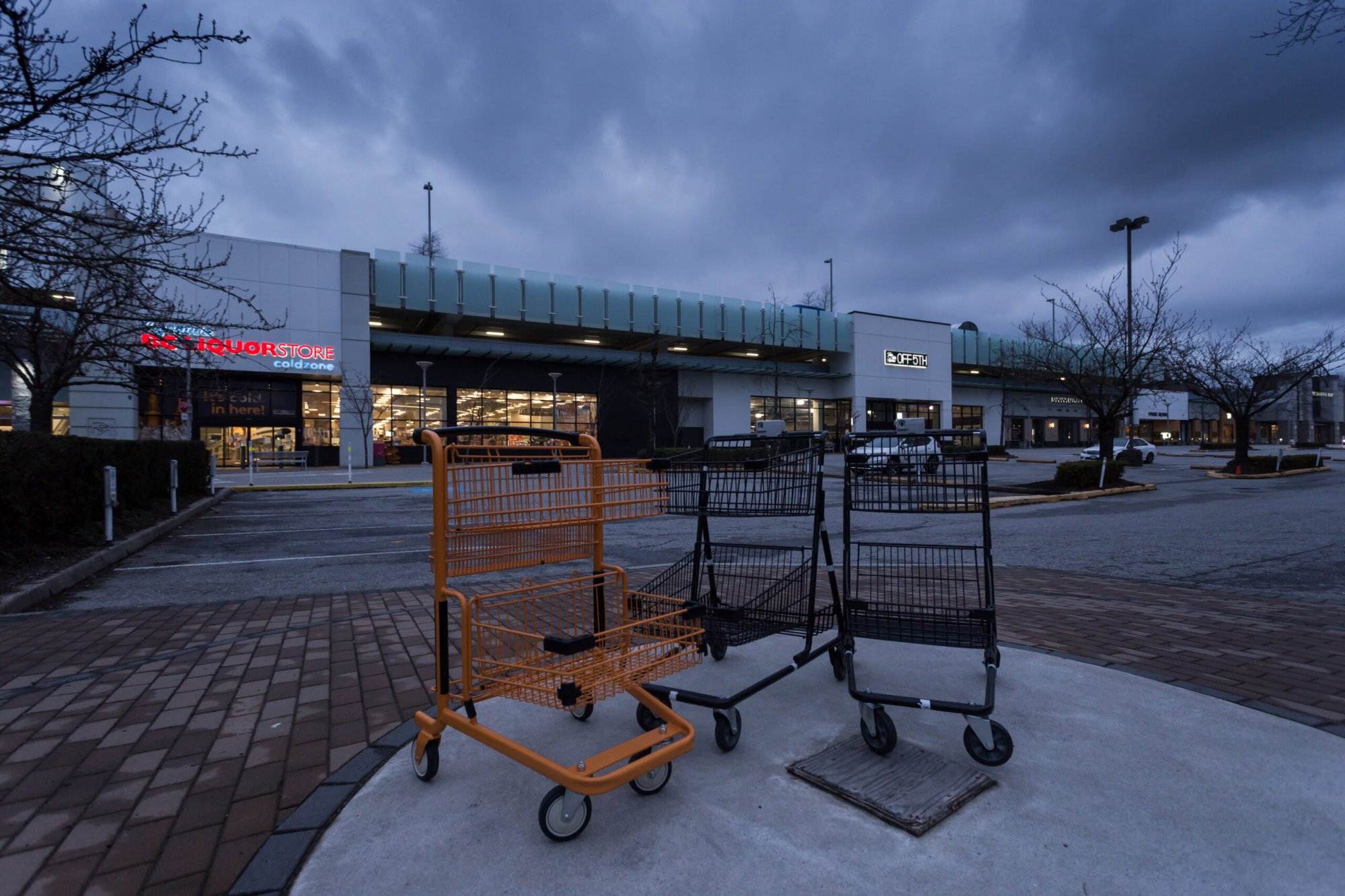 Empty parking lot at Park Royal shopping center during the evening time.