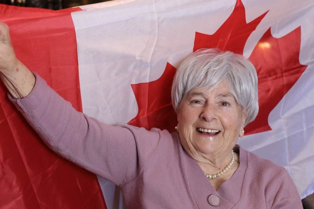 Old lady in Canada with Canadian flag