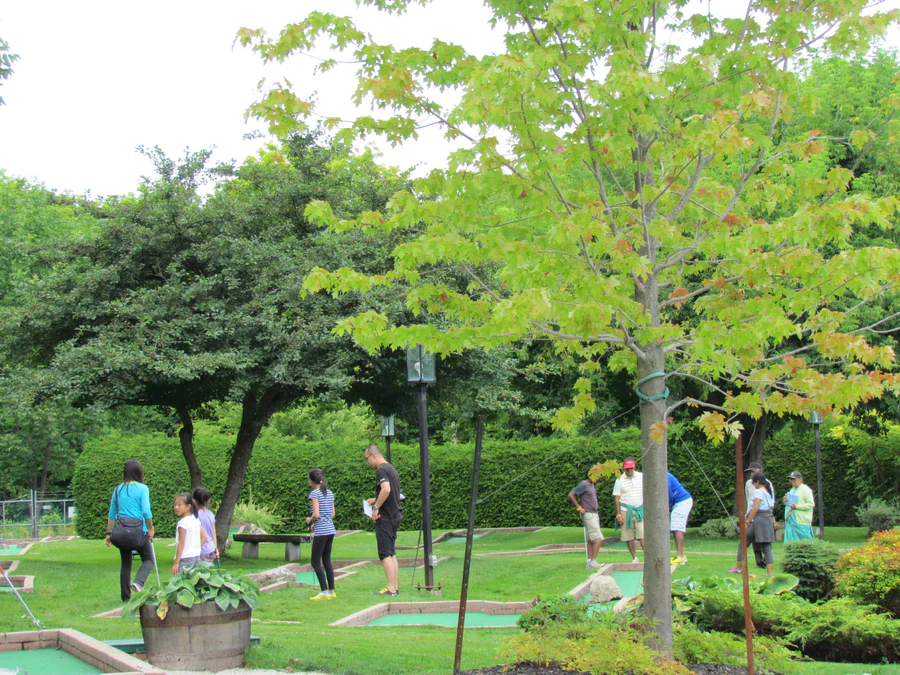 People in a field in at the Scenic Caves
