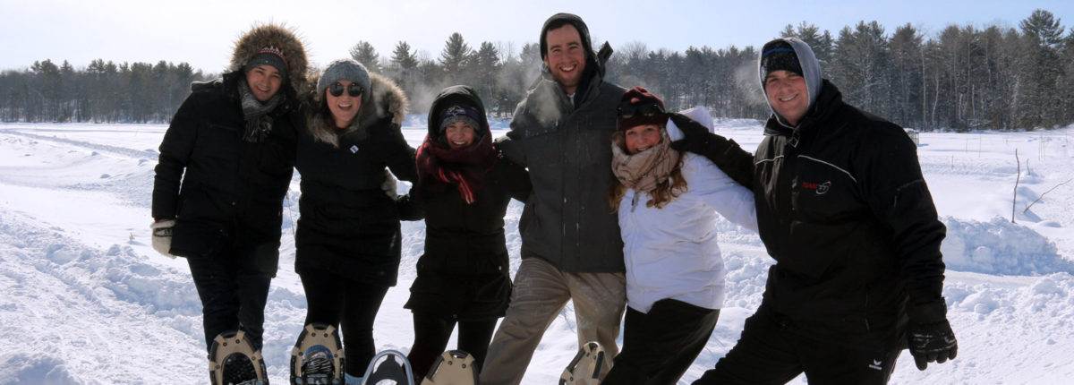 A group of people taking photo in Muskoka Lakes Farm & Winery 