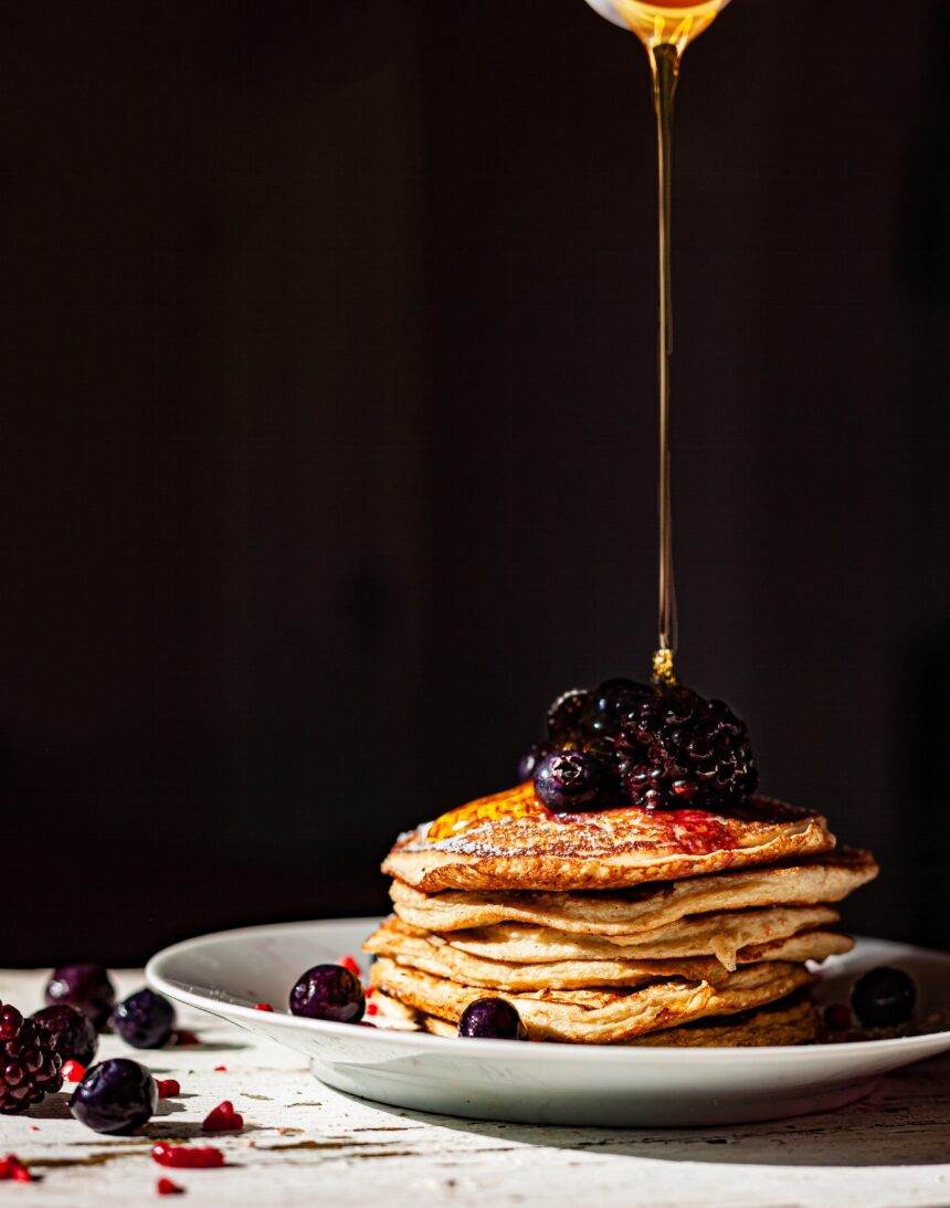 Honey dripping on the delicious pancakes.