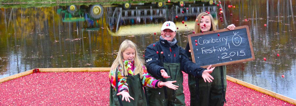 A happy family getting clicked for a picture at the Muskoka Lakes Farm & Winery 