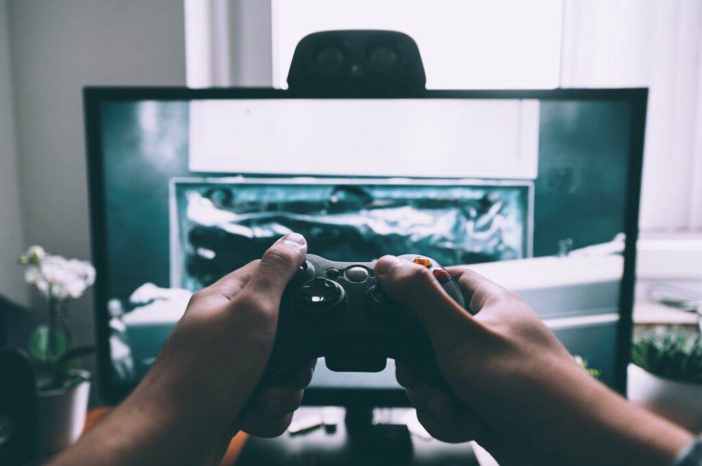 A person playing a game with a controller.
