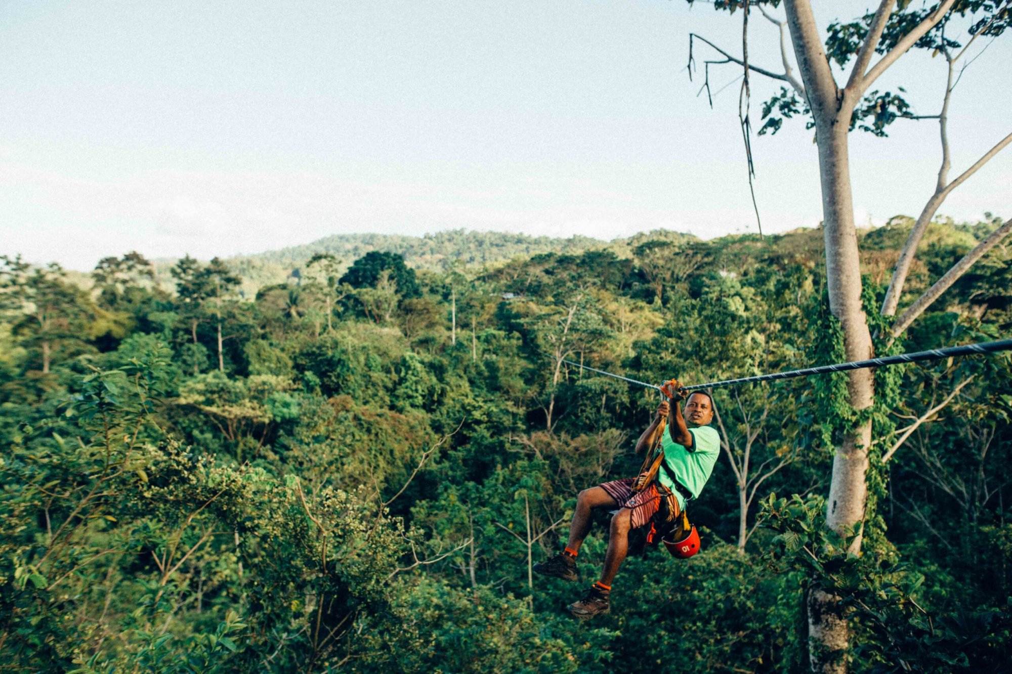 A man enjoying a ziplining experience on Costa Rica Island.