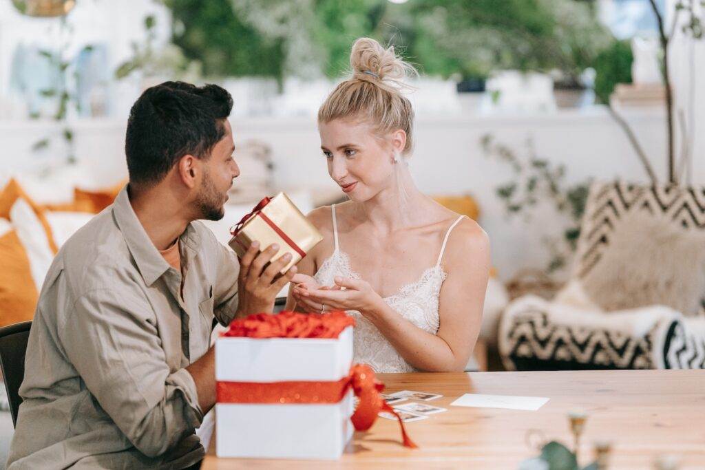 A boyfriend giving personalized gifts to her girlfriend.