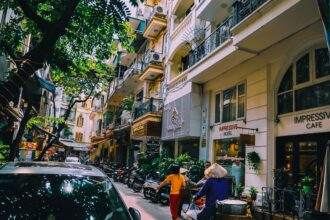People walking in front of buildings.