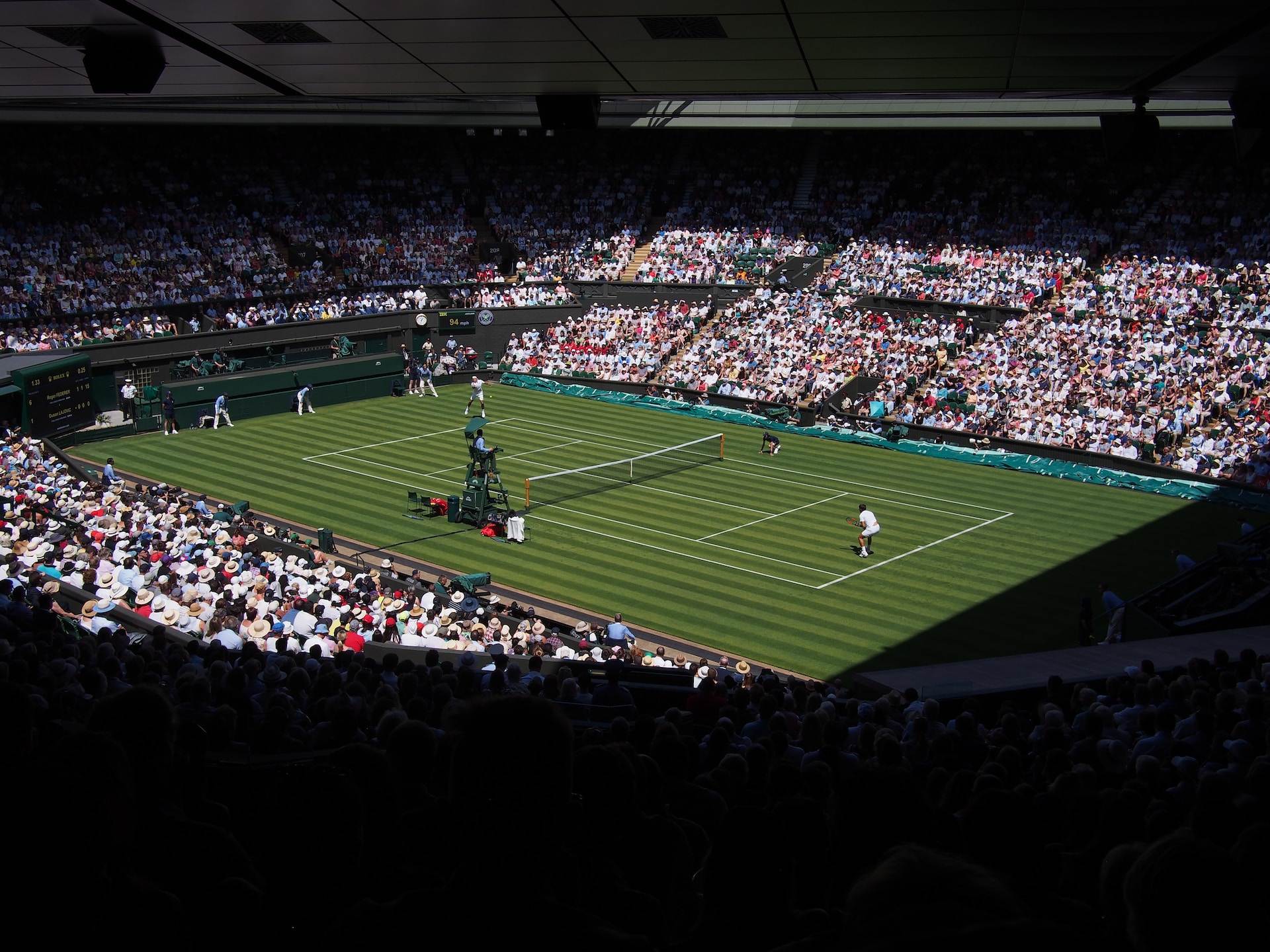 A tennis match in a stadium.