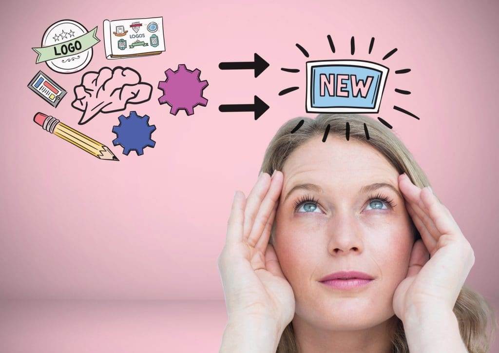 is a graphic design degree worth it? A woman looking at a graphic design that says 'new'