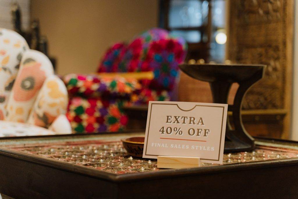 A discount coupon is kept on a table for a business deal.