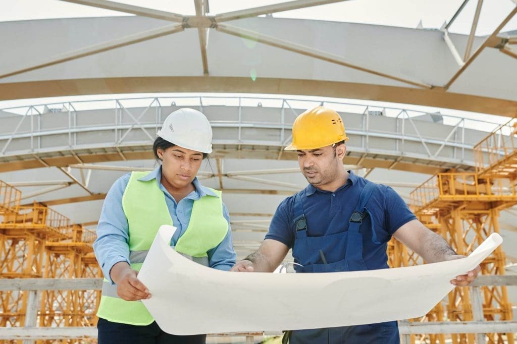 Construction managers looking at the design of the project