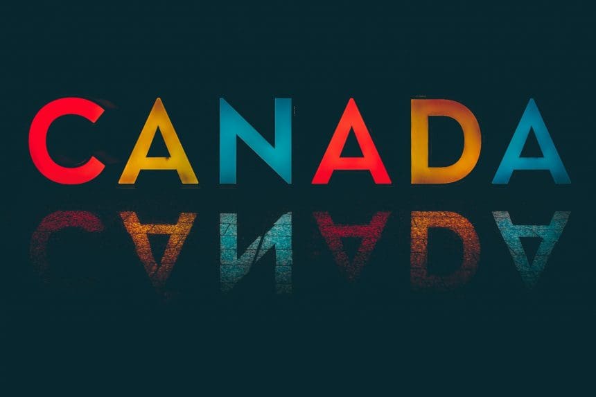 Colorful text art spelling Canada with reflection effect.