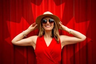 Woman in red with Canadian flag background