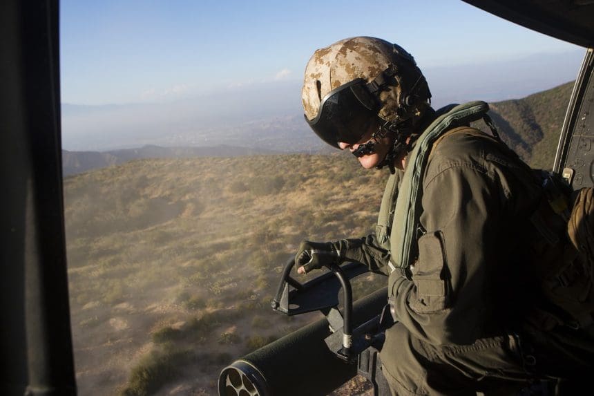 Flight crew member observing from helicopter